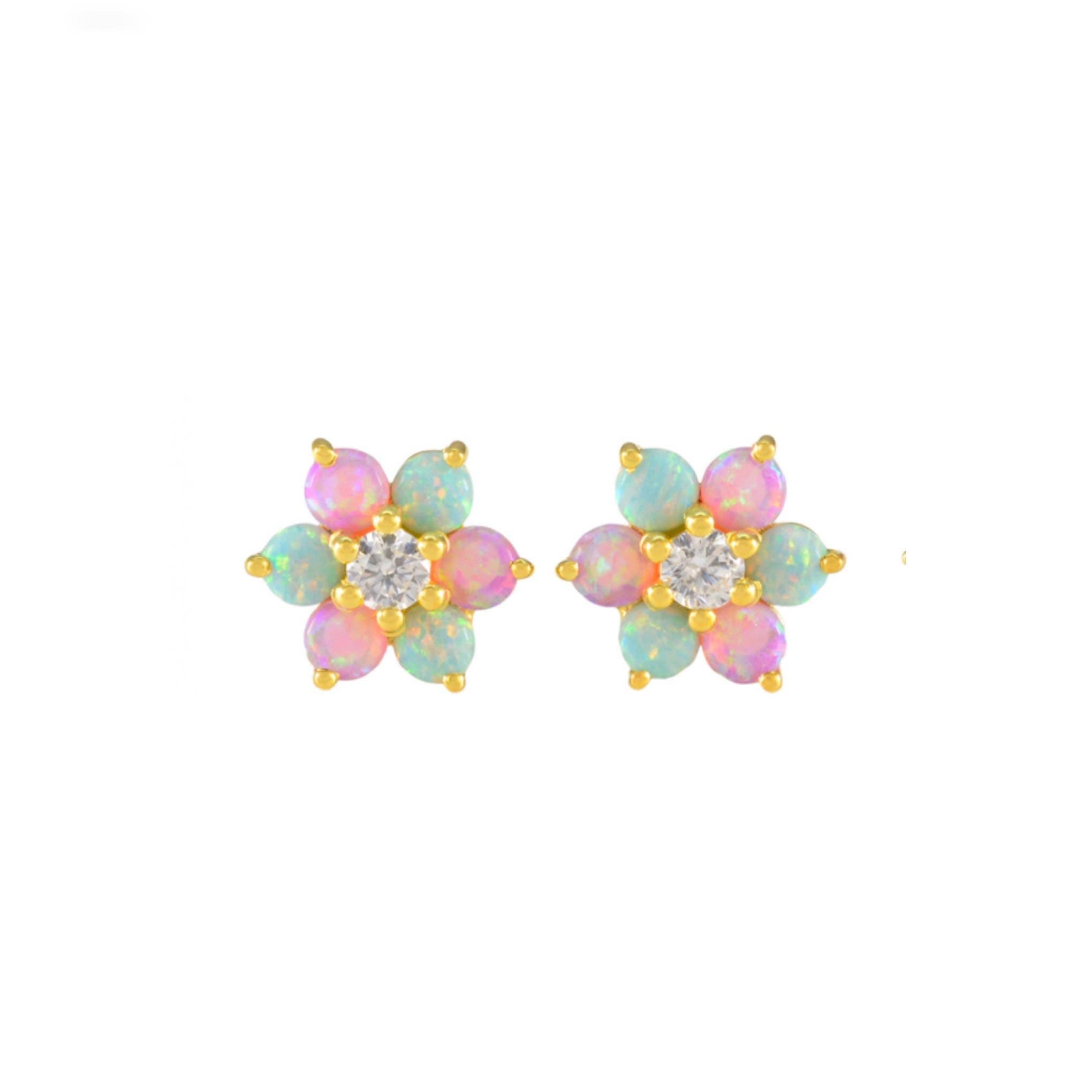 Pair of flower-shaped earrings with colorful petals and a central gemstone on a white background.