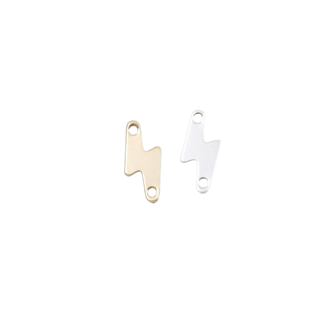 Two gold and silver metal tags on a white background