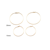 Set of gold hoop earrings with size labels on a white background